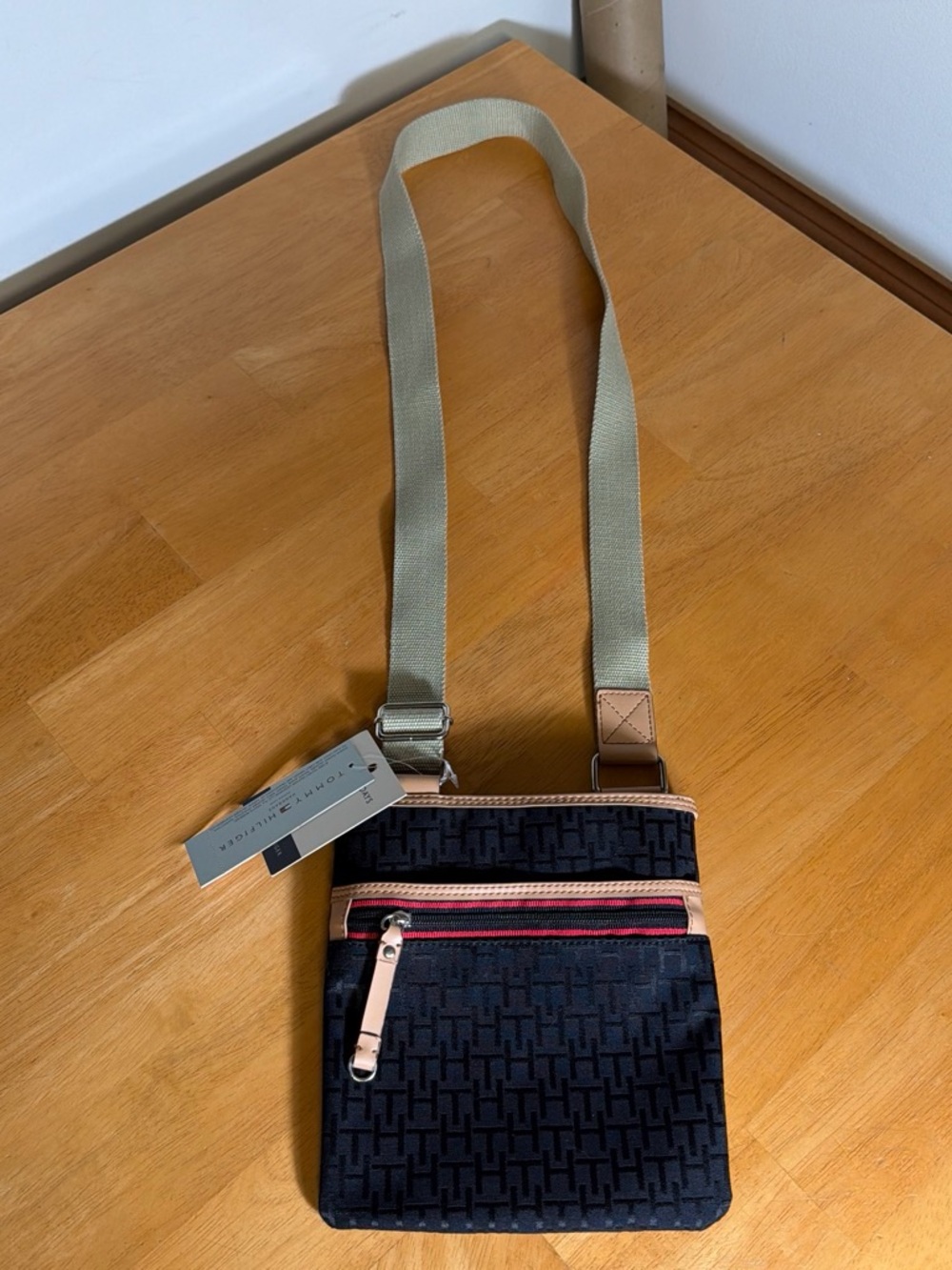 Tommy Hilfiger Black Monogram Crossbody with Beige Strap and Pink Zip Accent